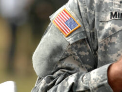 the American flag attached to the American military uniform.